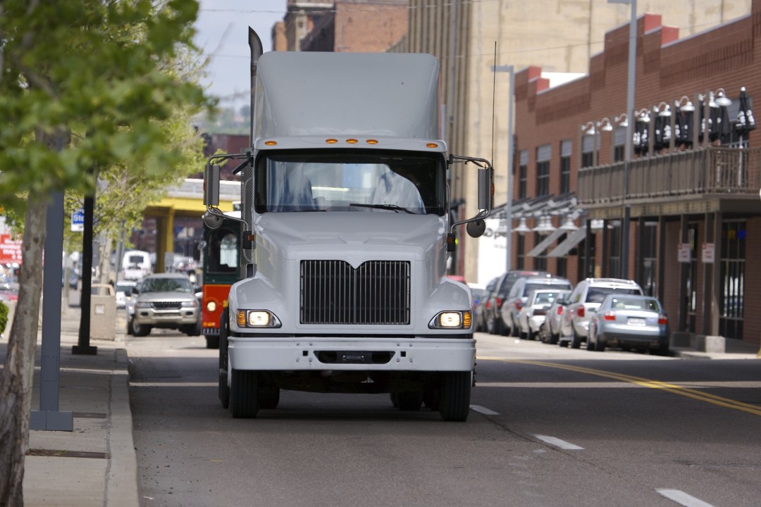 Semi Truck passing through Town