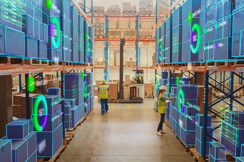 Warehouse scene with numerous boxes and individuals moving about, focused on holiday season pharmaceutical transport preparations.