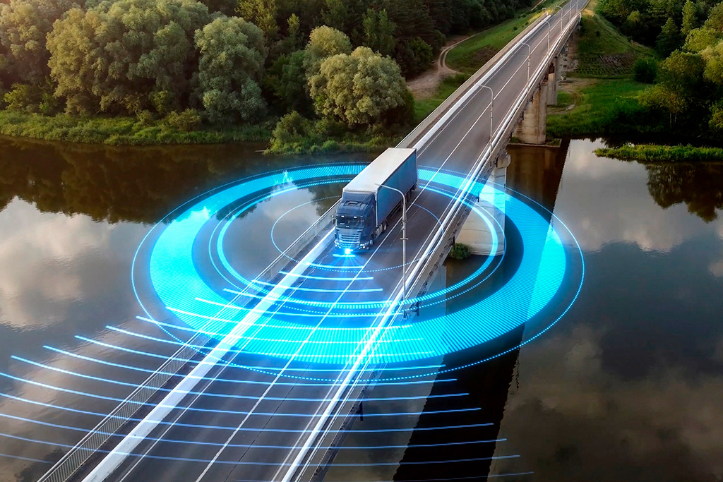 A truck on a bridge with a blue circle, representing strategies to reduce shipping costs for aftermarket auto parts.